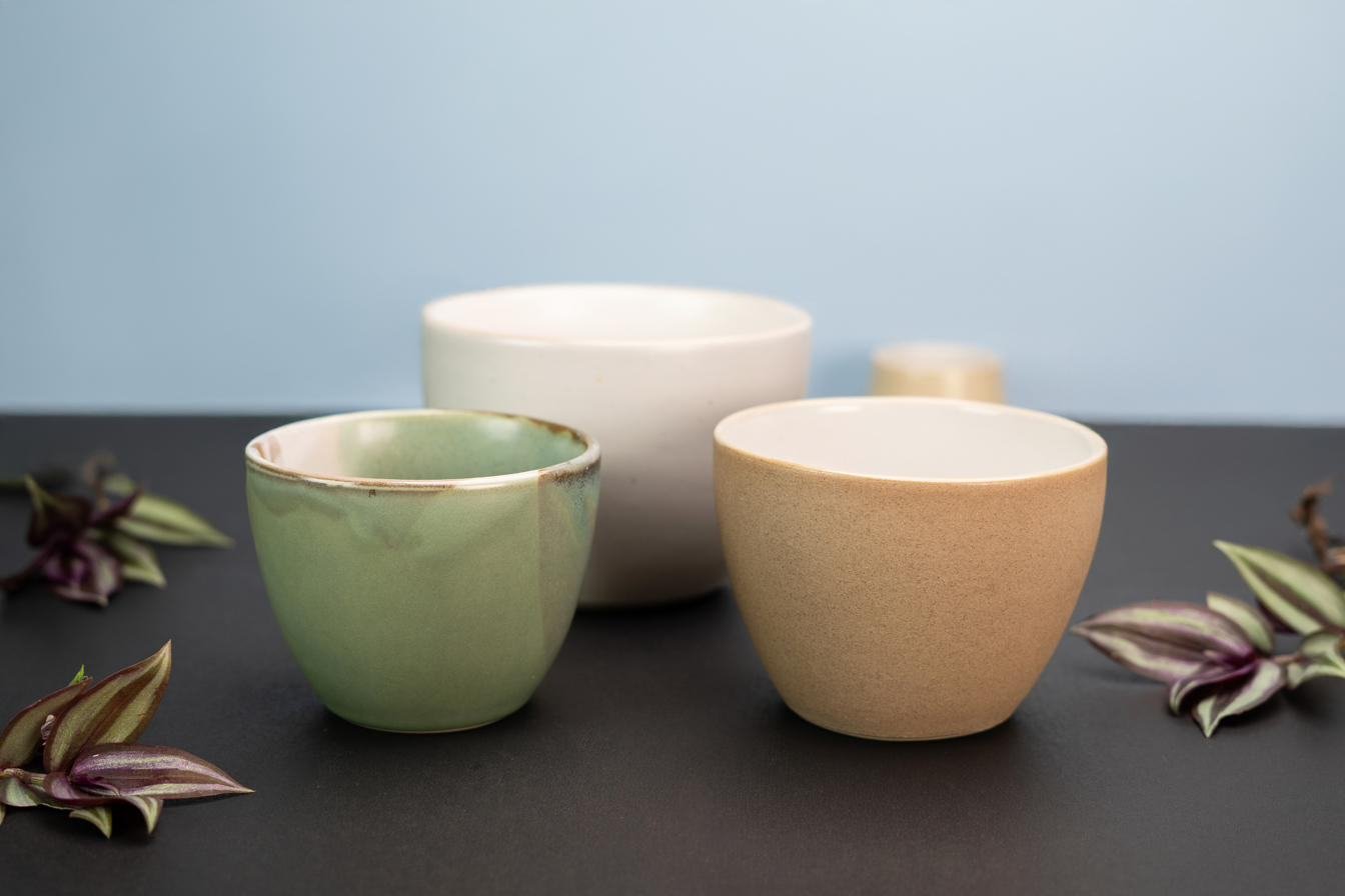 Stoneware bowls in sage and sand glazes