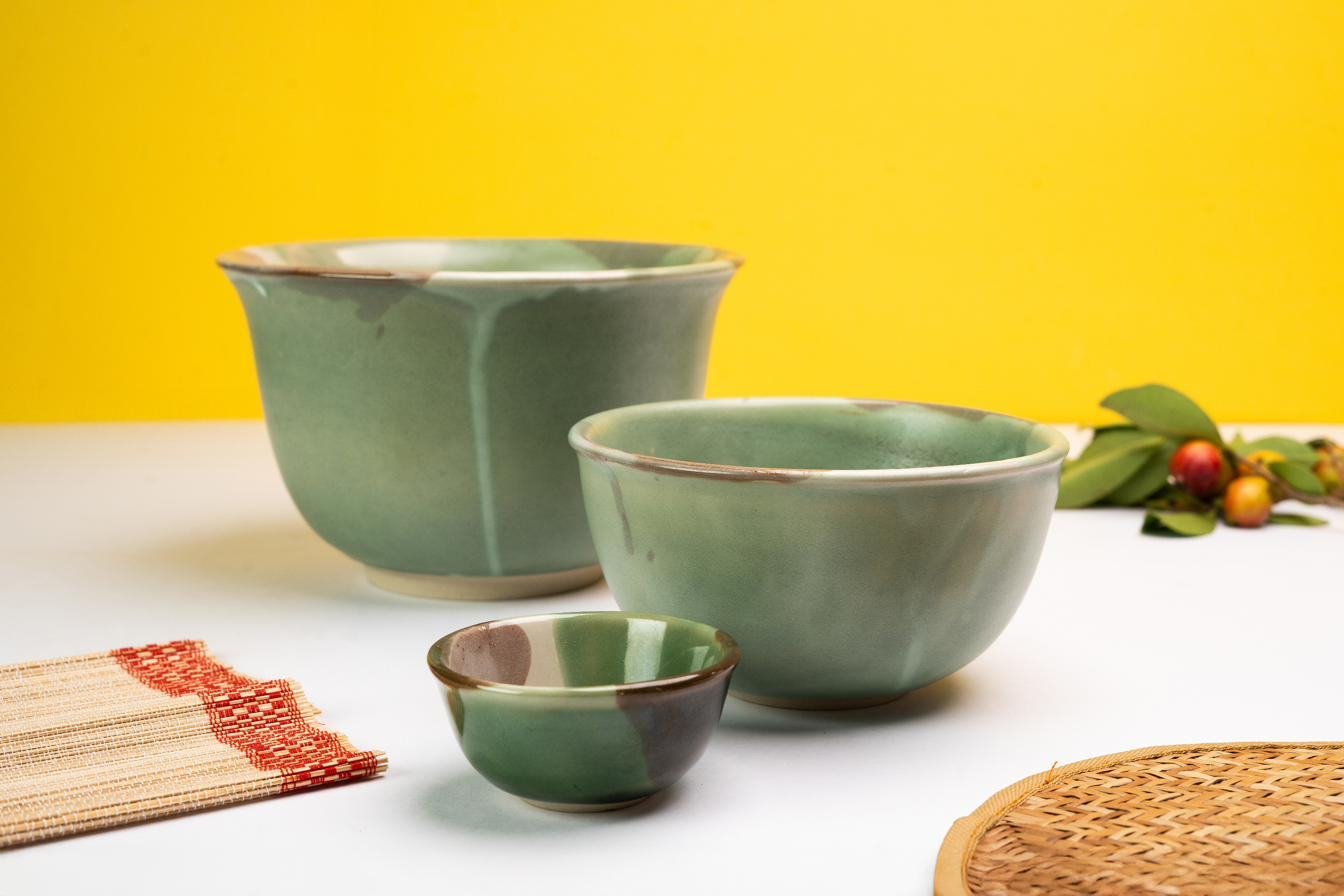 Green stoneware bowls with chopsticks