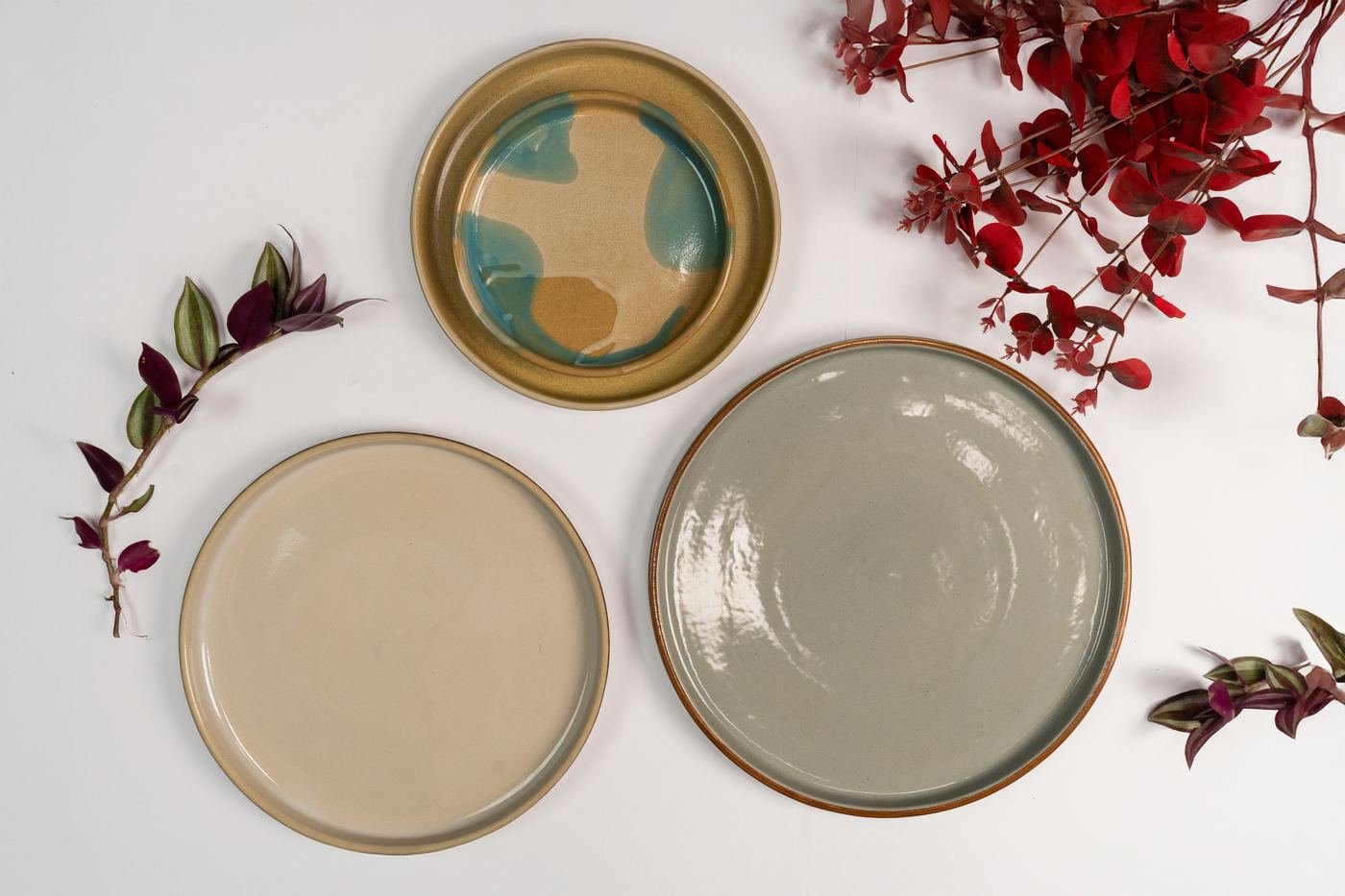 Handmade stoneware dinner plates arranged on a table