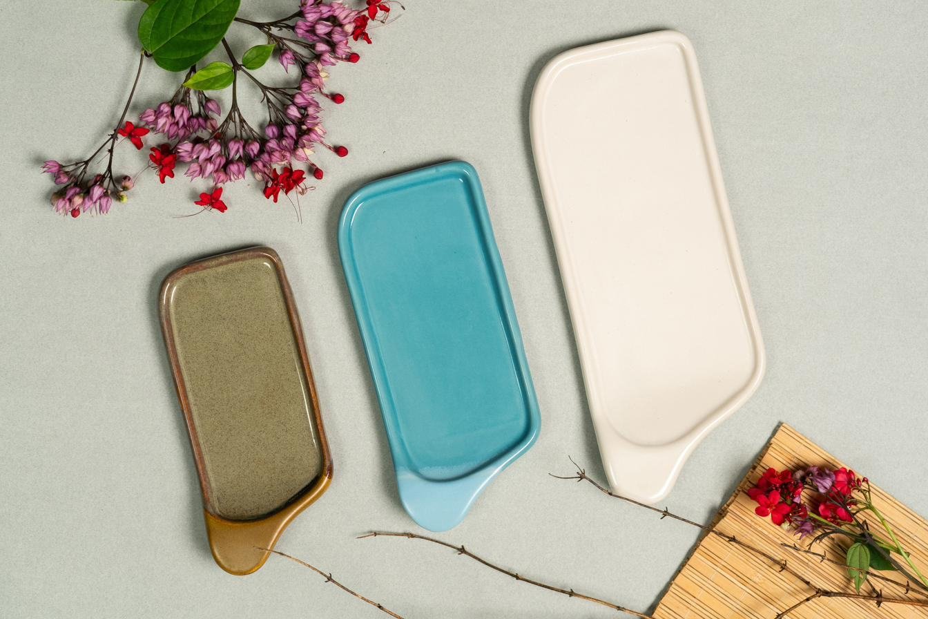 Glazed platters in teal and olive