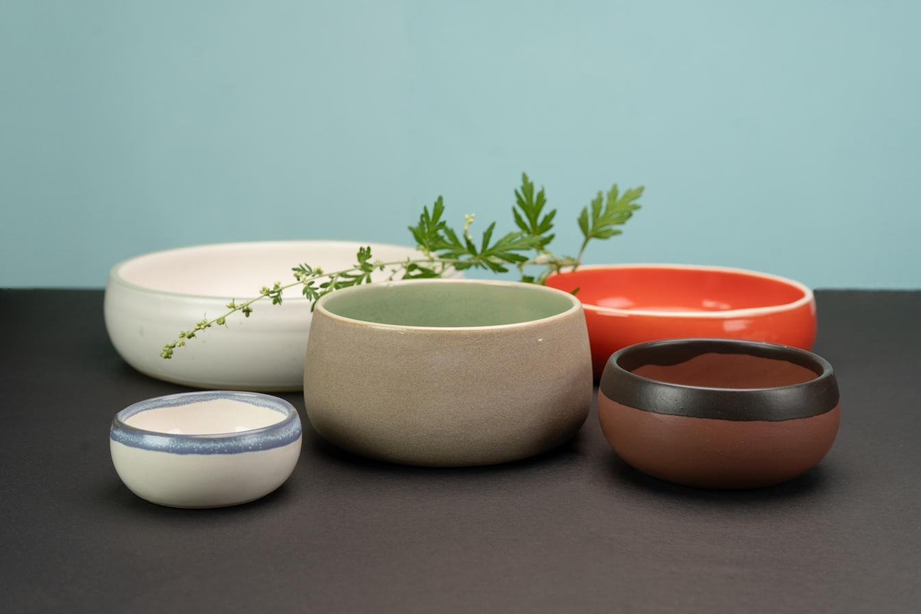 Bowls in white, sage and orange
